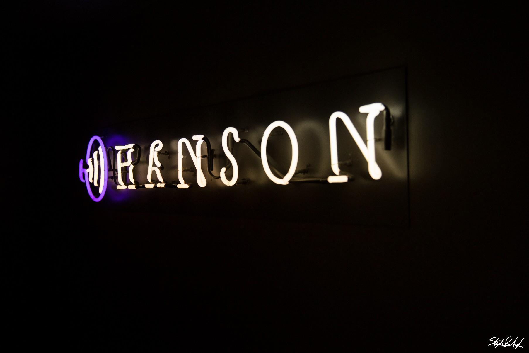 photo of the neon Hanson welcome sign in the lobby, courtesy of Steve Bumbaugh