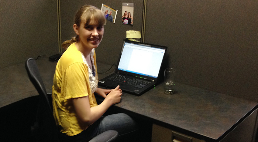 Hanson intern Lisa Wendel working on content at her computer